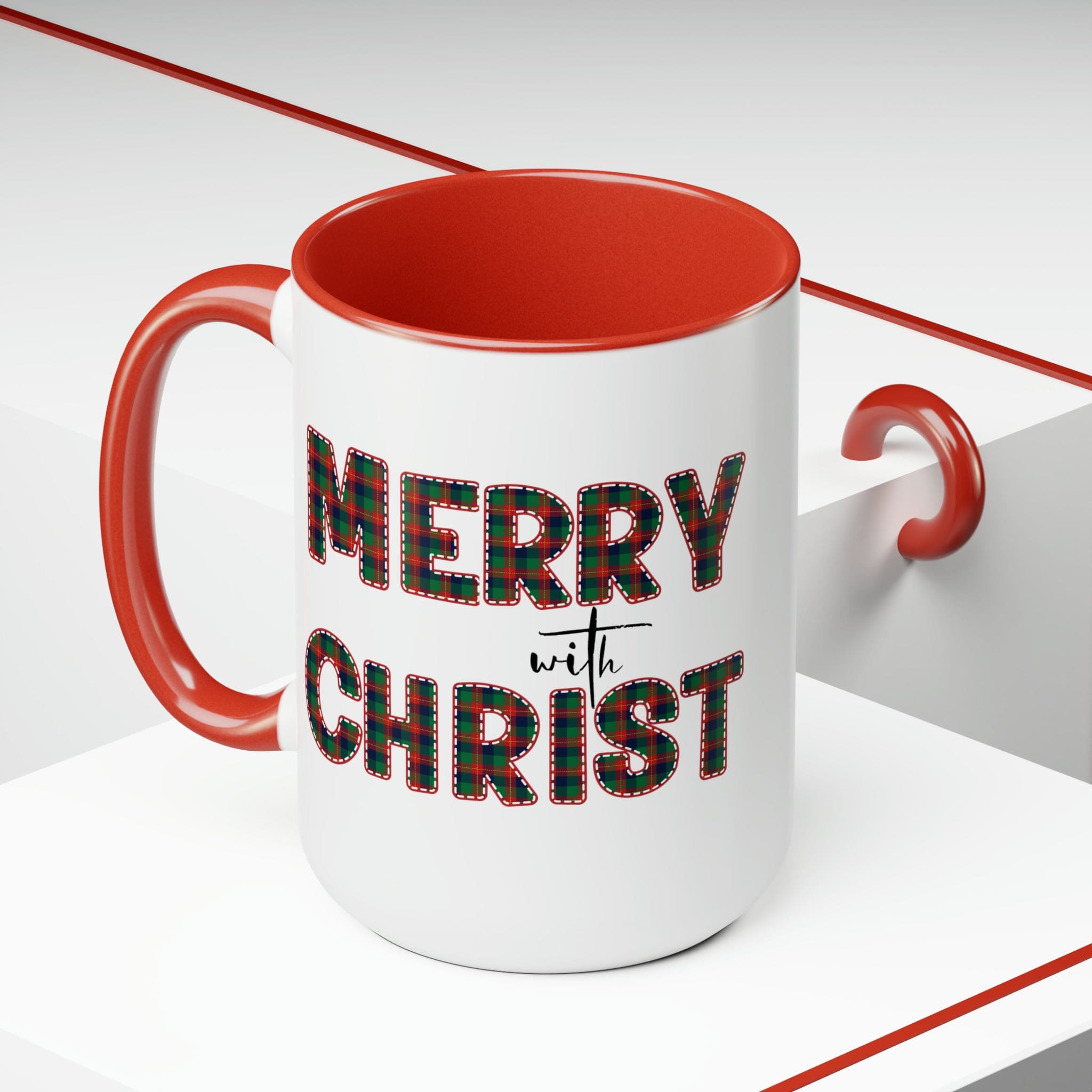 Accent Ceramic Coffee Mug 15oz featuring a Merry with Christ design in red and green plaid, perfect for holiday beverages.