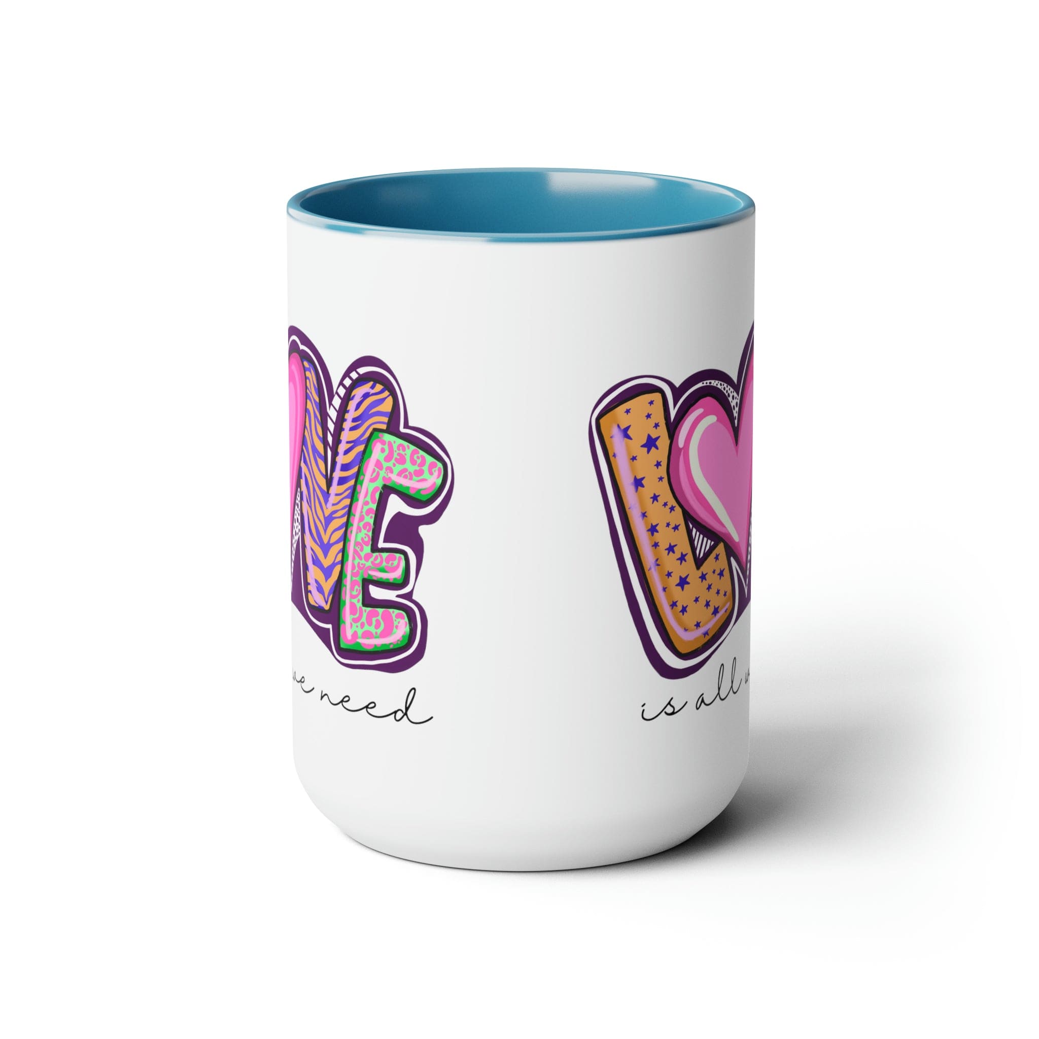 Accent Ceramic Coffee Mug 15oz with a white exterior and colorful interior, featuring the phrase 'Love is All we Need' on the side.