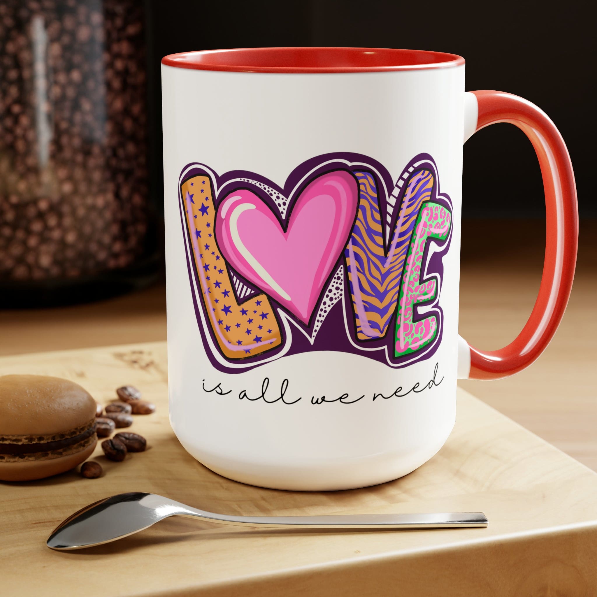 Accent Ceramic Coffee Mug 15oz with a white exterior and colorful interior, featuring the phrase 'Love is All we Need' on the side.