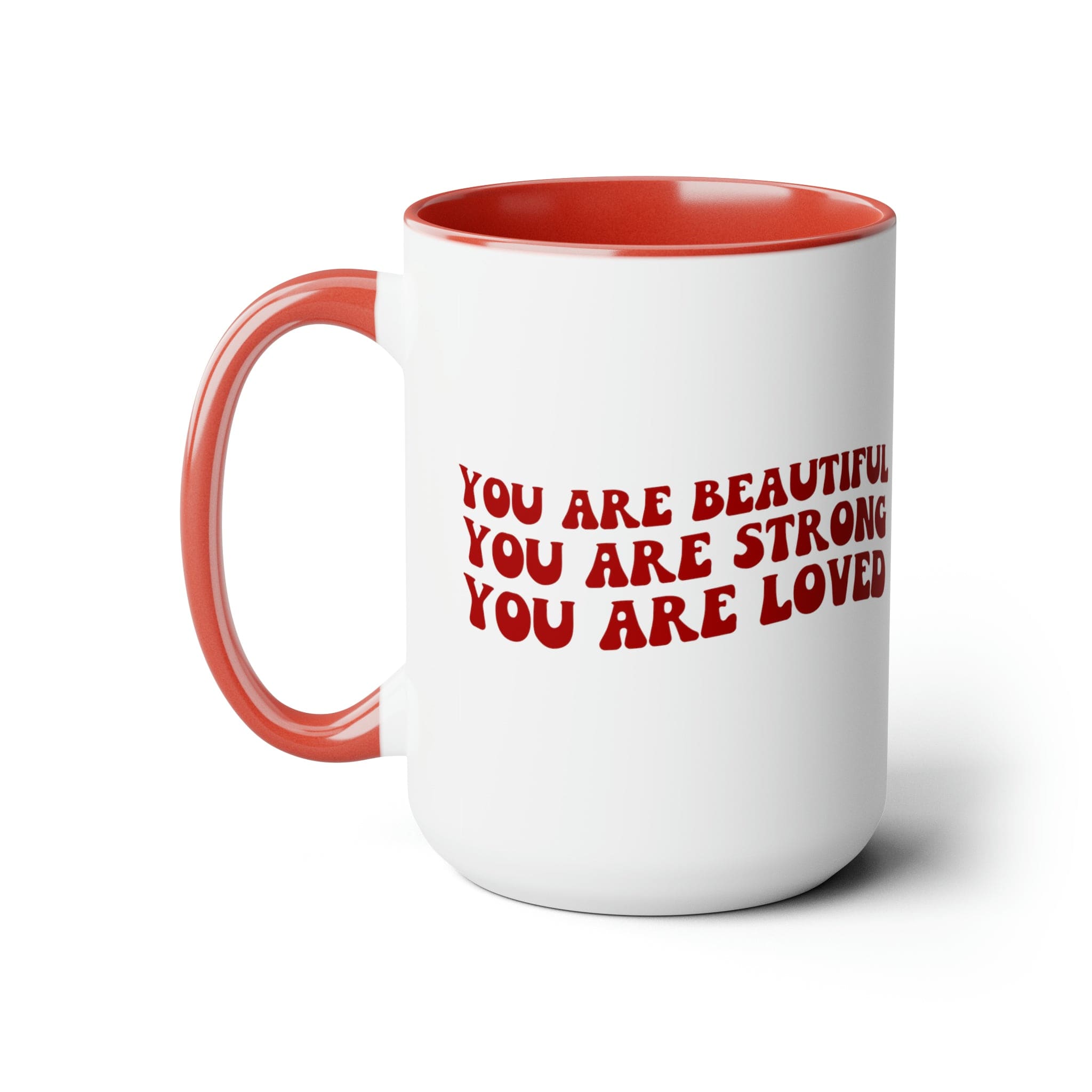 Red ceramic coffee mug with a white exterior and colored interior, featuring the inspirational message 'You Are Beautiful Strong Loved'.