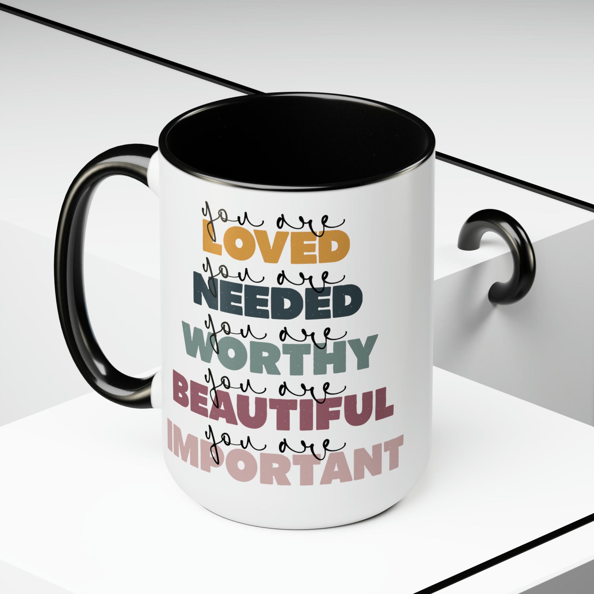 You Are Loved Ceramic Coffee Mug with a white exterior and colored interior, featuring a C-handle and inspirational message.