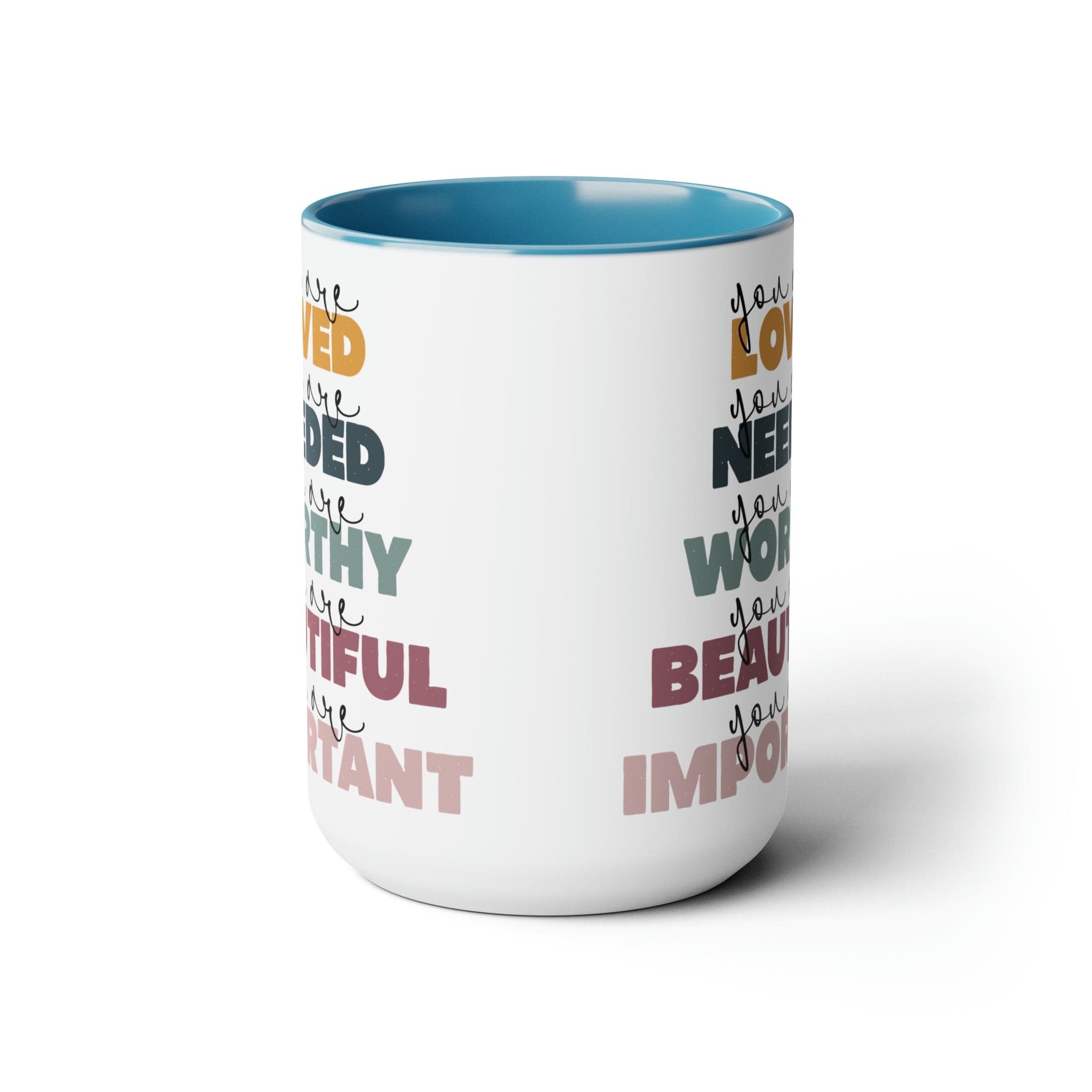 You Are Loved Ceramic Coffee Mug with a white exterior and colored interior, featuring a C-handle and inspirational message.