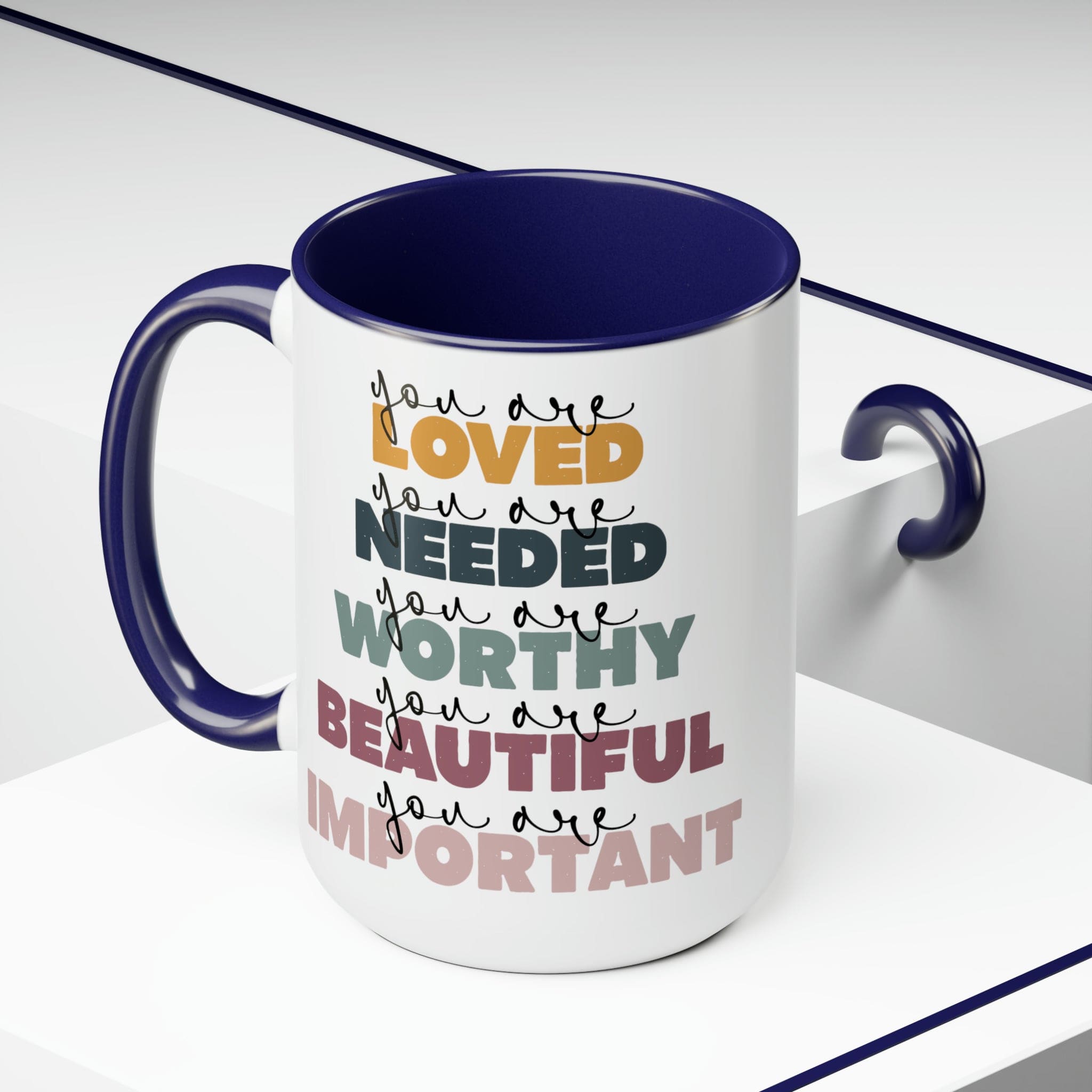 You Are Loved Ceramic Coffee Mug with a white exterior and colored interior, featuring a C-handle and inspirational message.