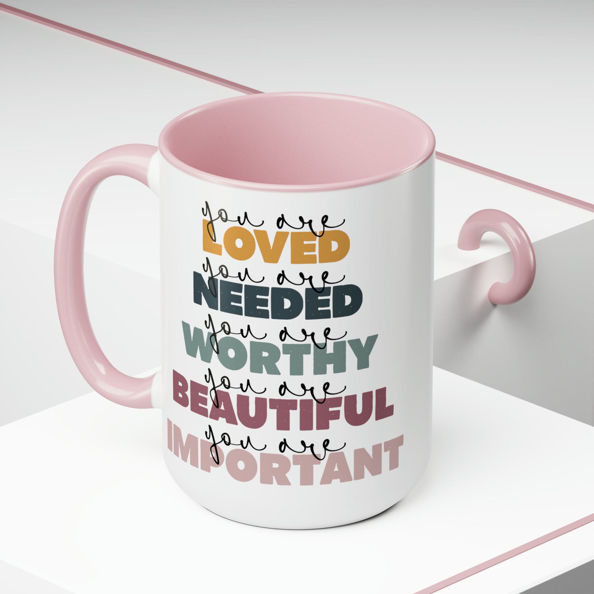 You Are Loved Ceramic Coffee Mug with a white exterior and colored interior, featuring a C-handle and inspirational message.