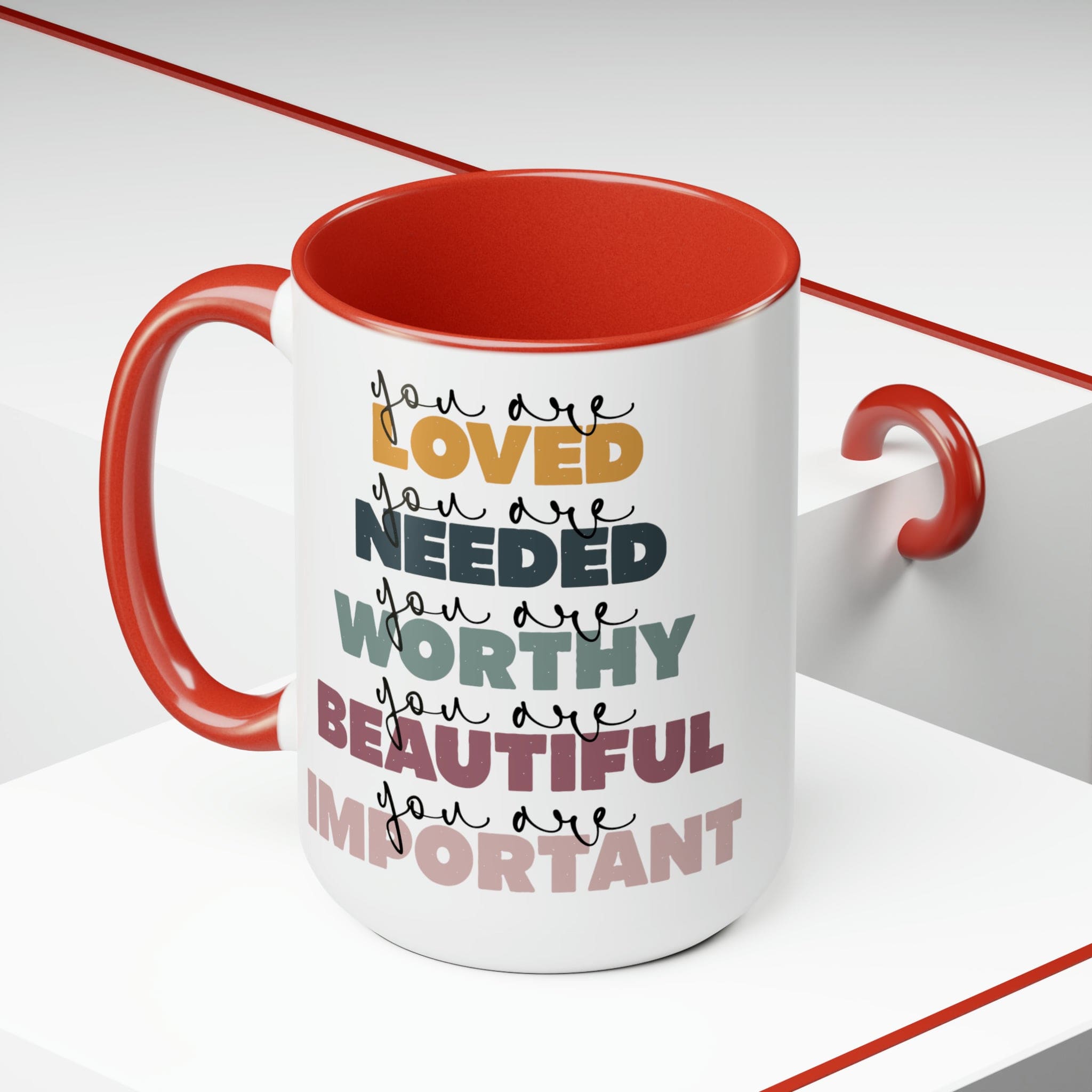 You Are Loved Ceramic Coffee Mug with a white exterior and colored interior, featuring a C-handle and inspirational message.