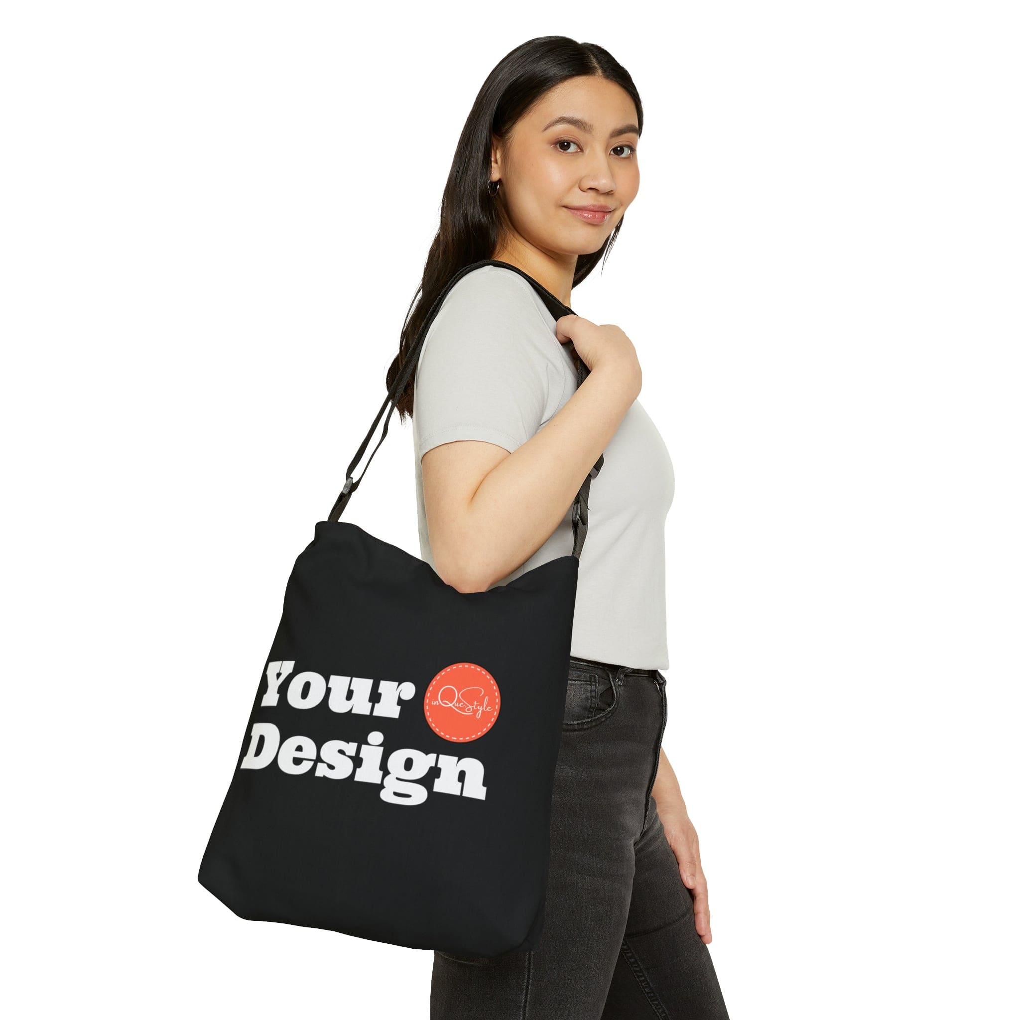 Adjustable Black Tote Bag made of spun polyester with adjustable straps and zippered pocket.