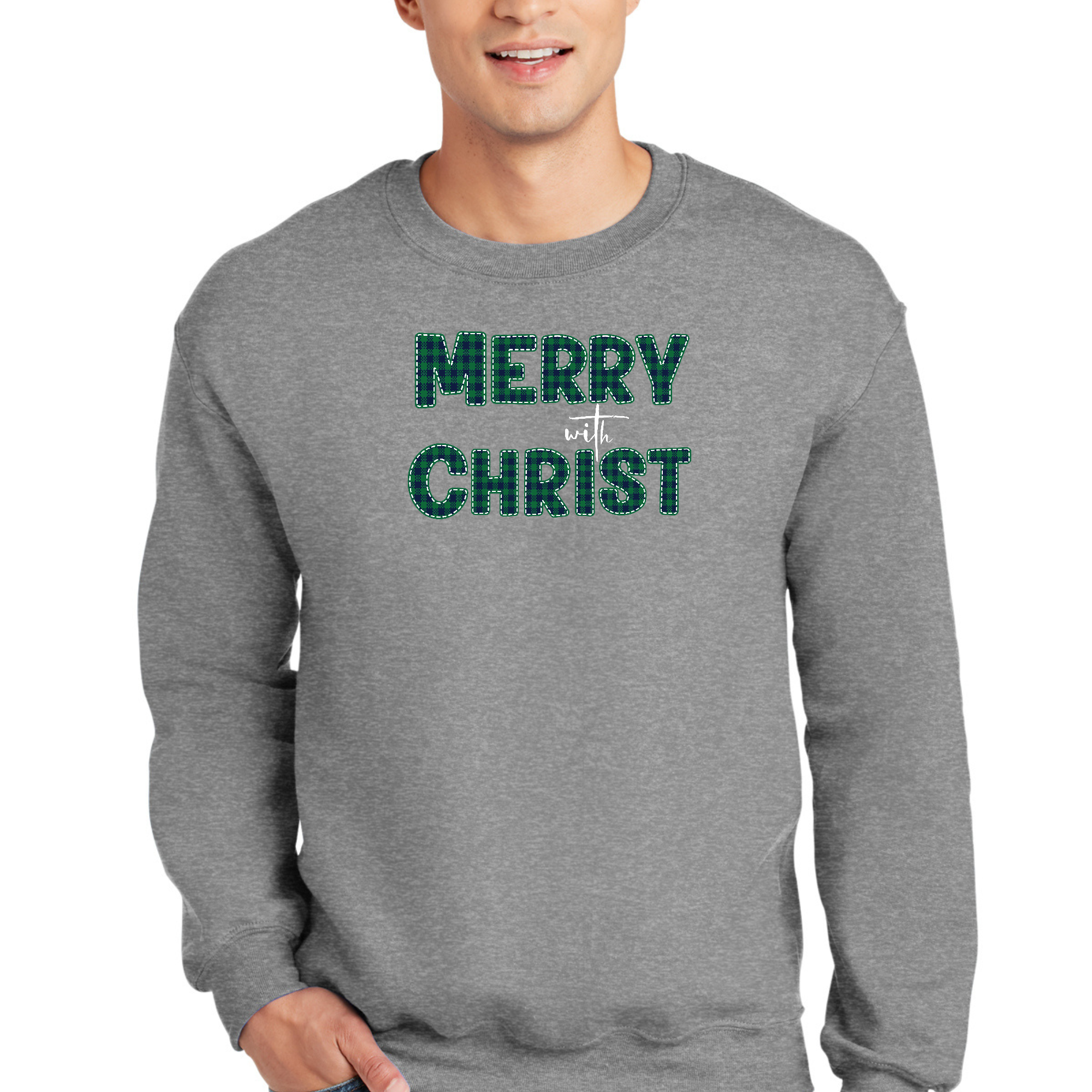 Adult unisex long sleeve sweatshirt in green plaid with Merry With Christ graphic design, showcasing its soft fabric and comfortable fit.