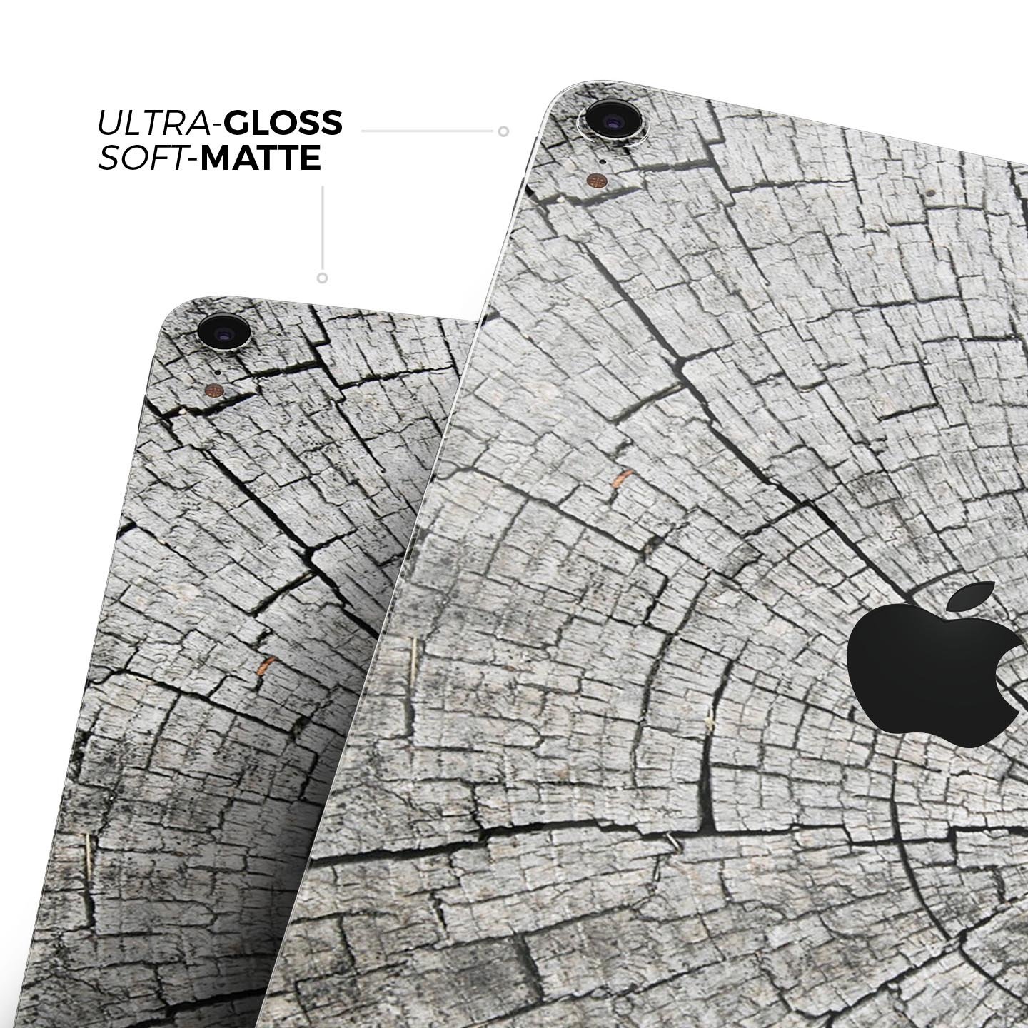 Aged Cracked Tree Stump Core skin decal for Apple iPad, showcasing a rustic design with premium 3M material for protection.