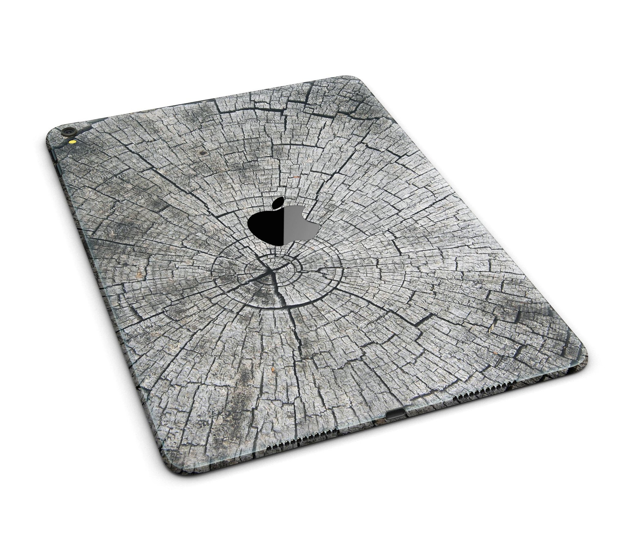 Aged Cracked Tree Stump Skin for iPad Pro, showcasing a natural wood texture design that wraps around the device for full-body protection.