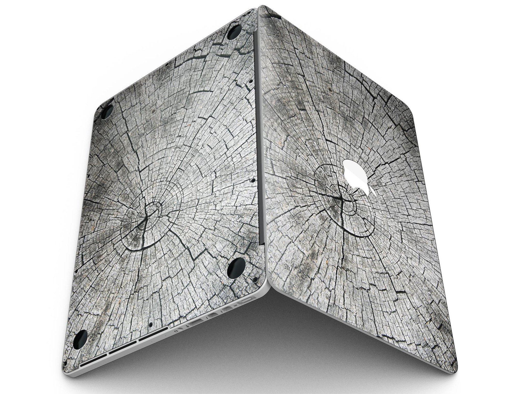 Aged Cracked Tree Stump Core skin for MacBook Pro with Retina Display, showcasing a unique design that adds style and protection.