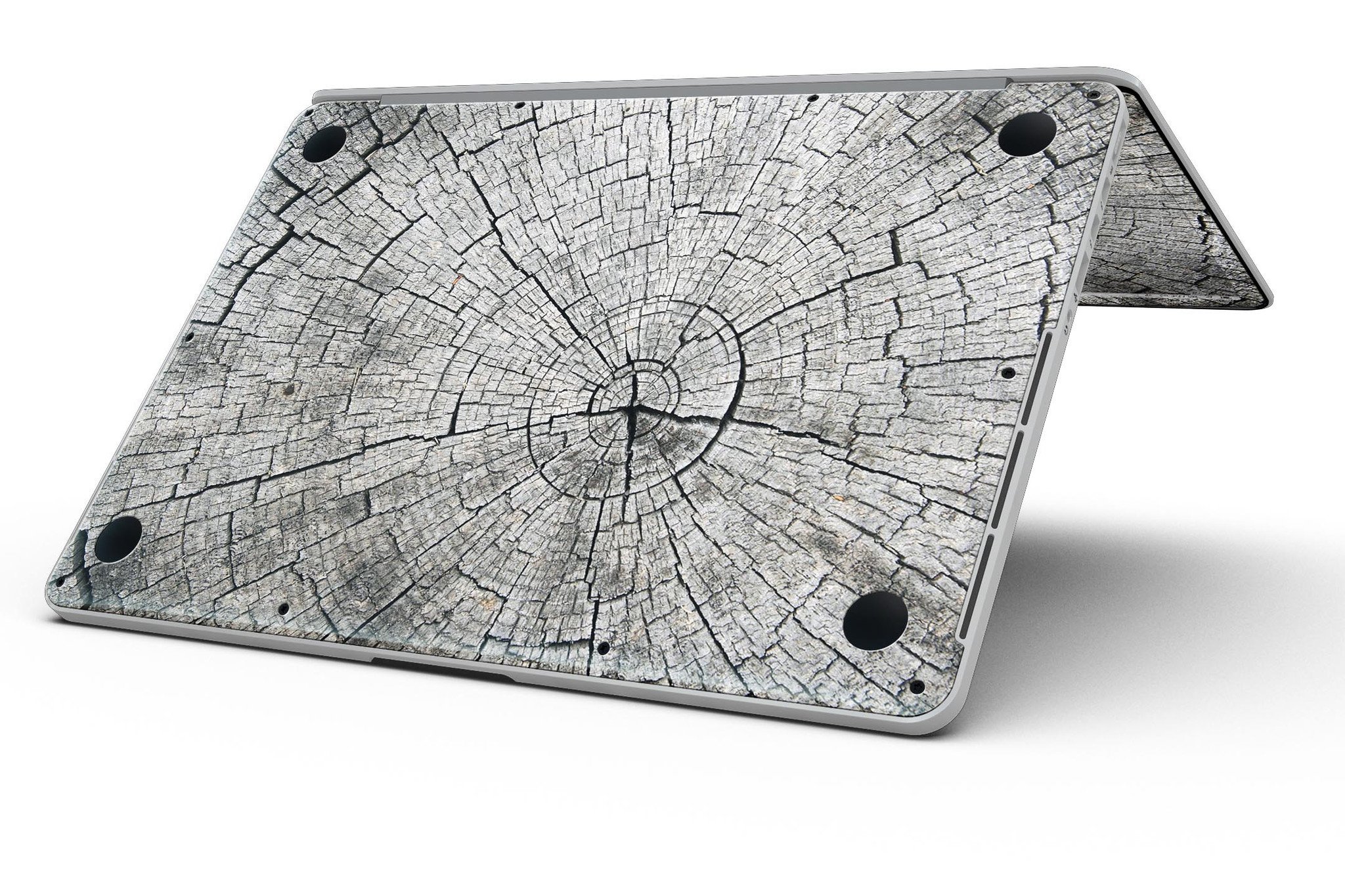 Aged Cracked Tree Stump Core skin for MacBook Pro with Retina Display, showcasing a unique design that adds style and protection.