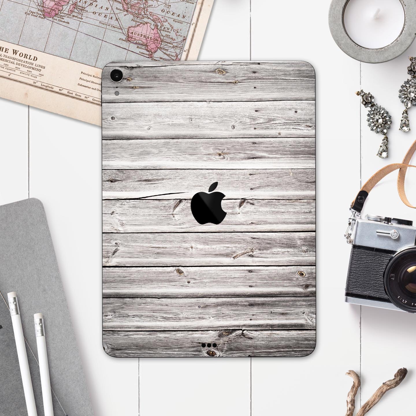 Aged White Wood Planks skin decal for Apple iPad Pro, showcasing a rustic wood design that enhances device aesthetics.