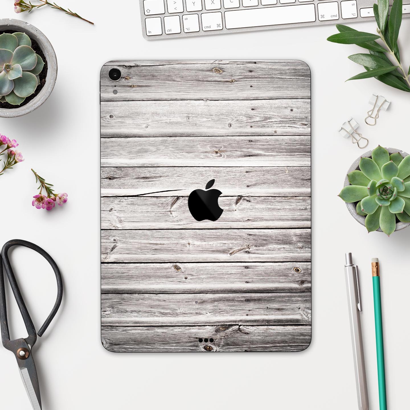 Aged White Wood Planks skin decal for Apple iPad Pro, showcasing a rustic wood design that enhances device aesthetics.