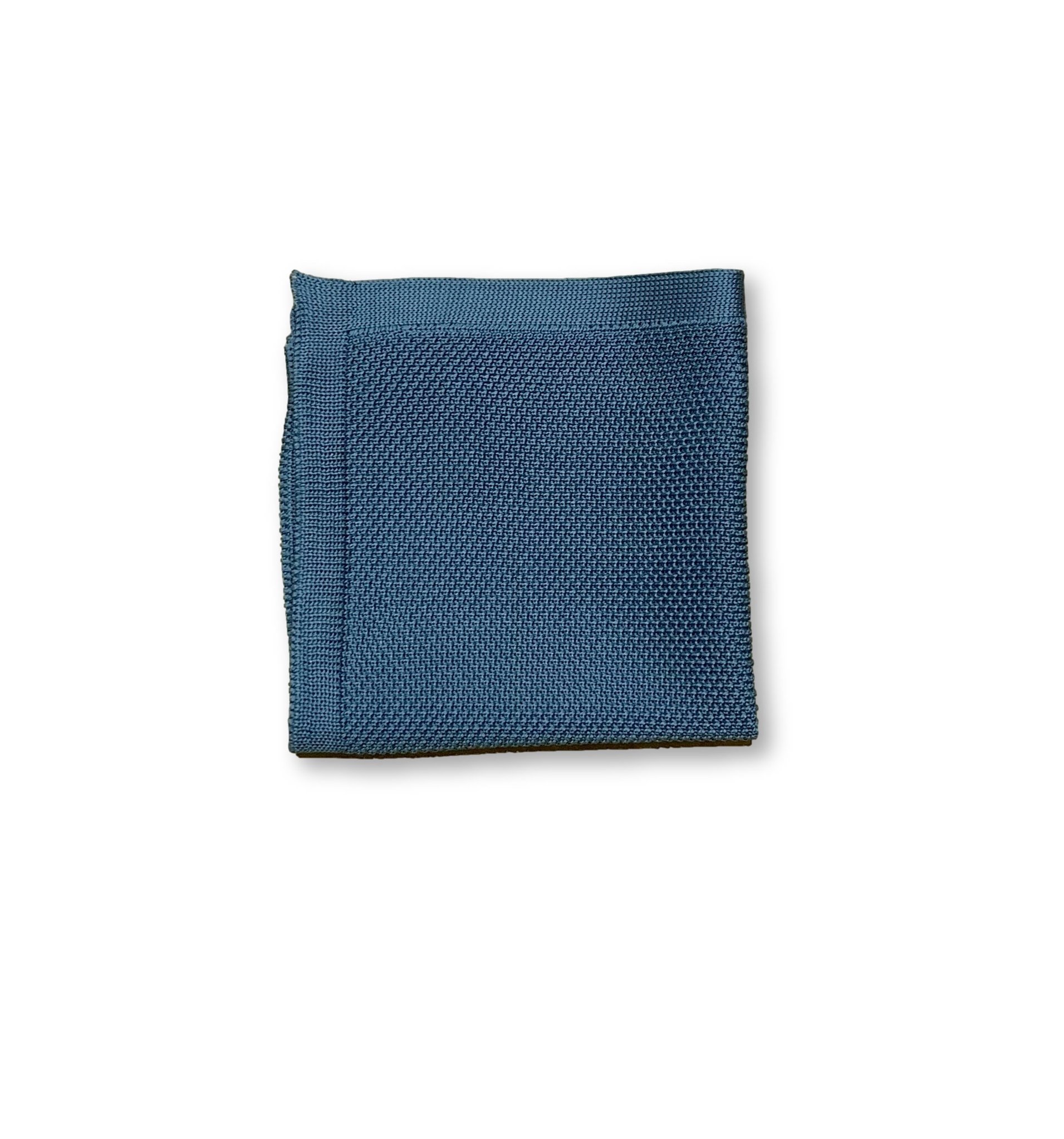 Air Force Blue knitted pocket square displayed elegantly, showcasing its rich color and texture.