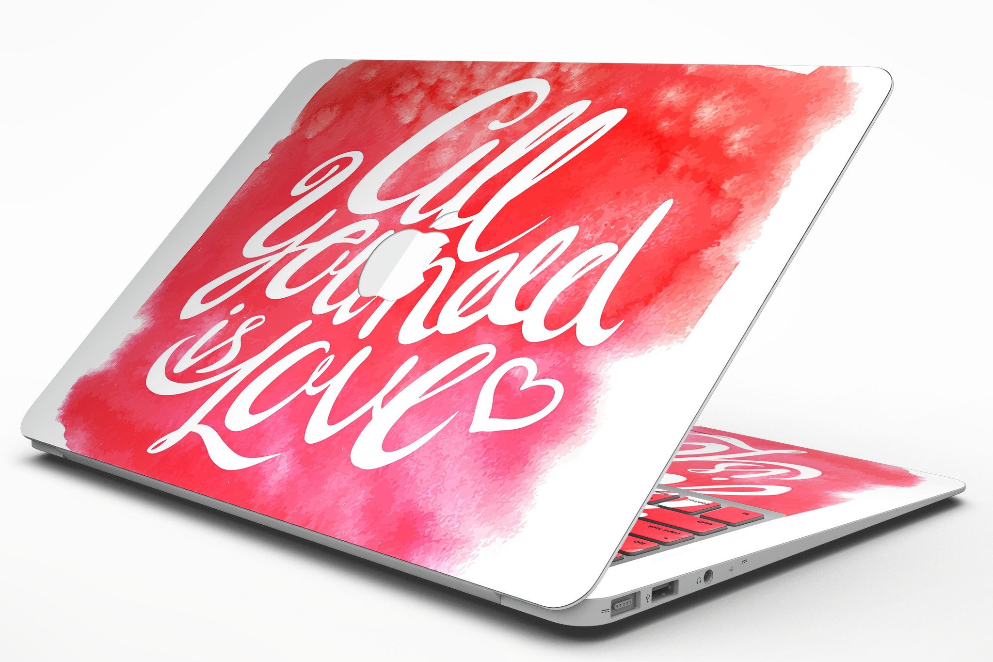 All You Need is Love MacBook Air Skin Kit featuring a vibrant design, showcasing its premium vinyl material and sleek finish.