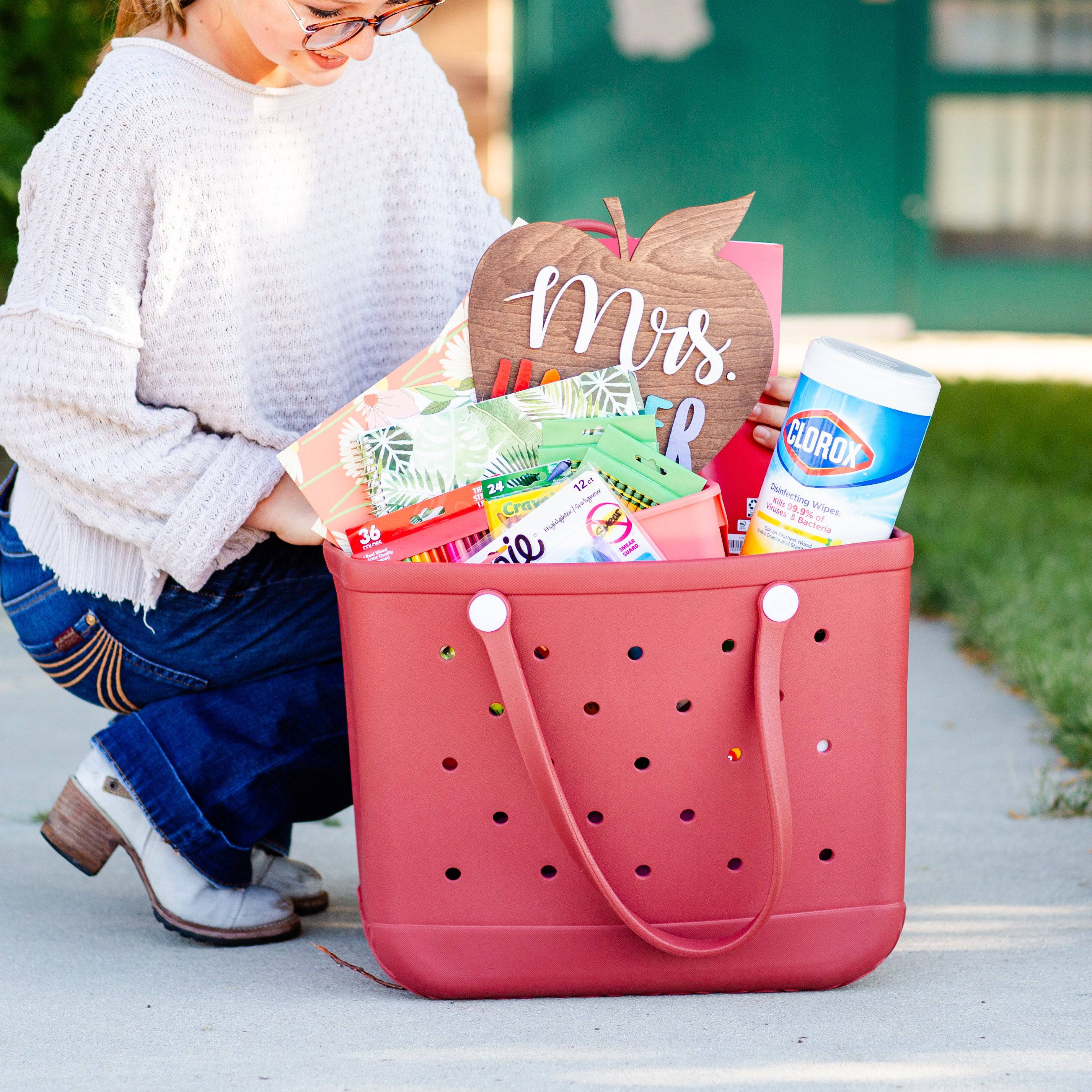 A vibrant All-Around Adventure X-Large Eva Tote in various colors, showcasing its spacious design and double handles, perfect for any occasion.