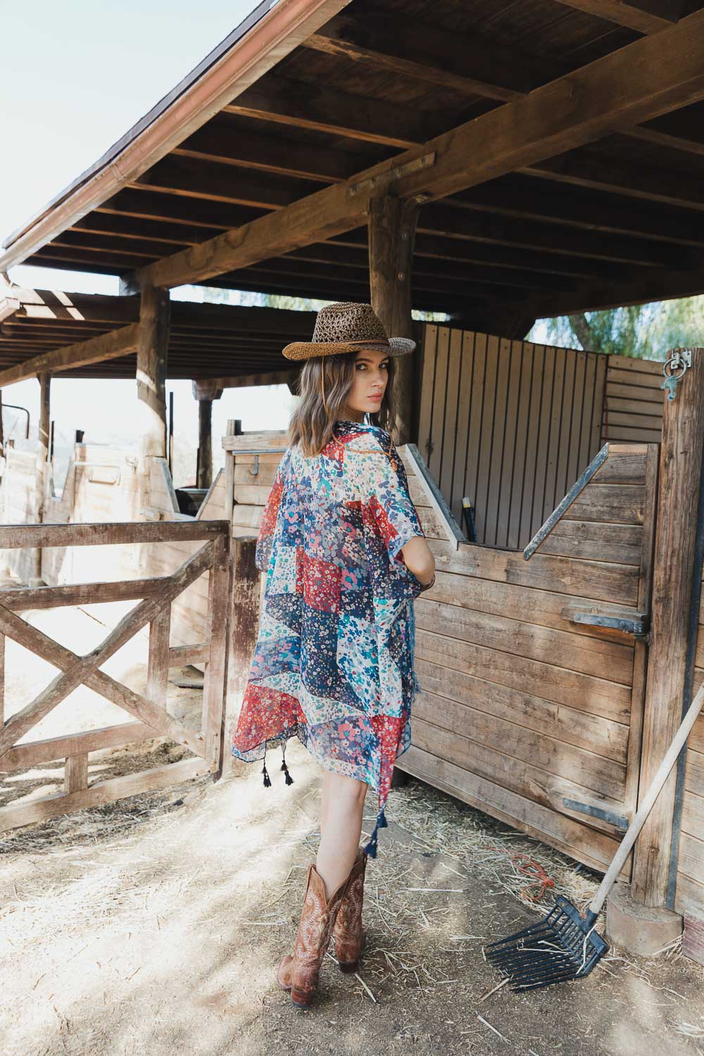 A stylish Allover Floral Print Kimono featuring vibrant floral patterns, lightweight fabric, and loose structured sleeves, perfect for layering.