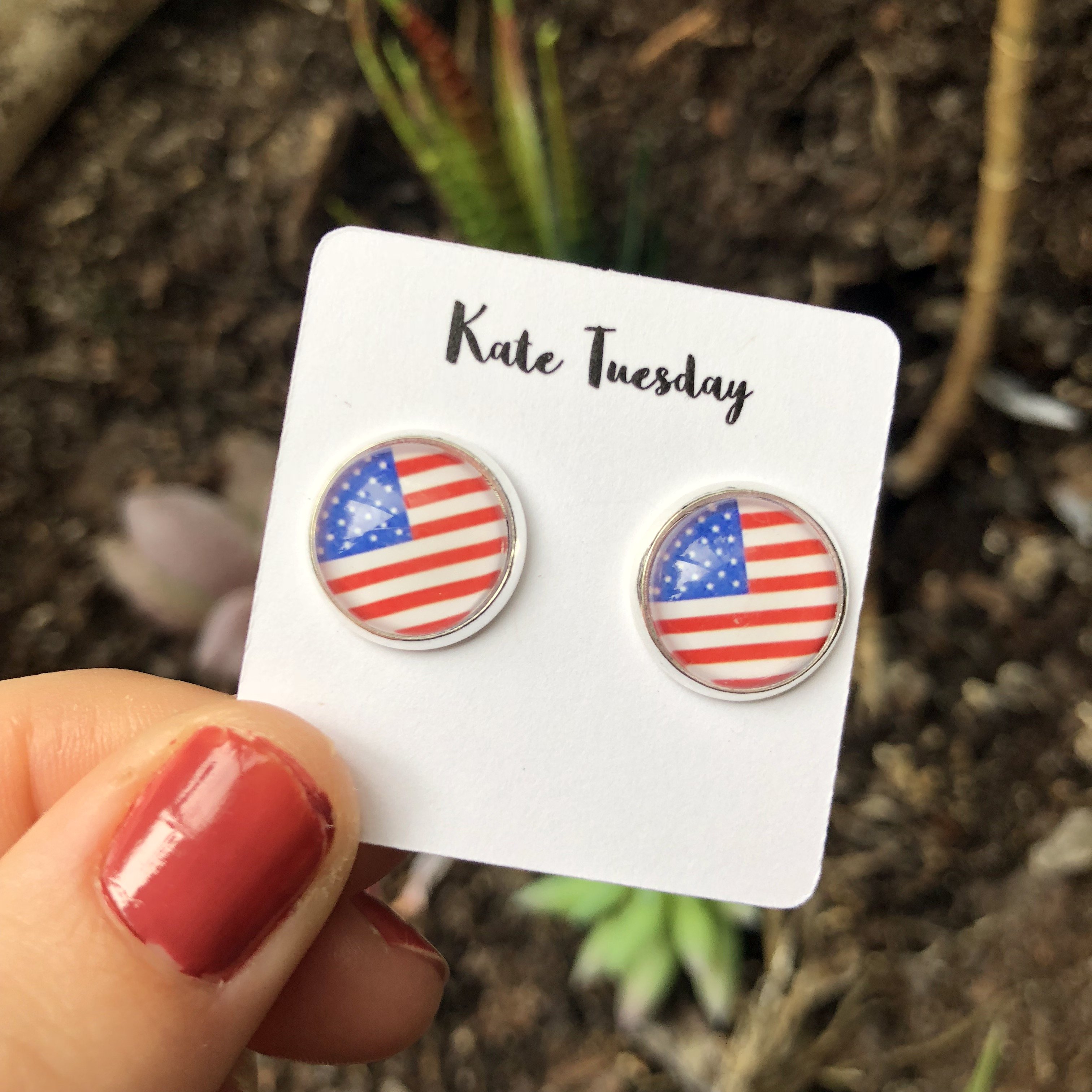 A pair of 12mm American Flag Earrings featuring vibrant colors and intricate design, perfect for patriotic occasions.