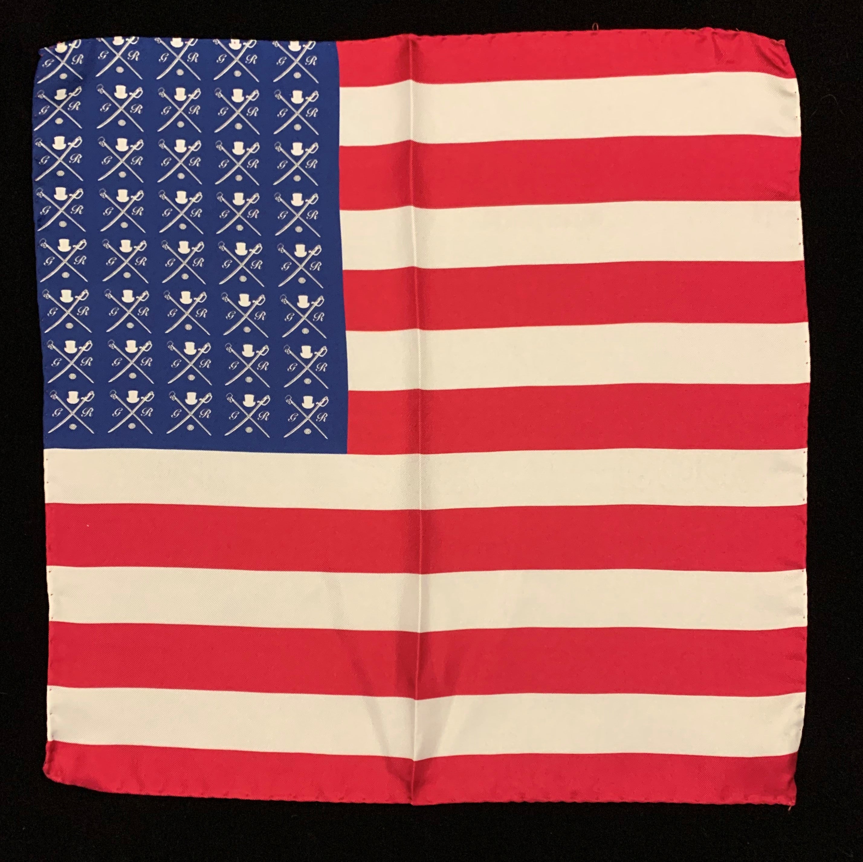 American Rogue Pocket Square featuring a vibrant American flag design in red, white, and blue, made from luxurious silk.