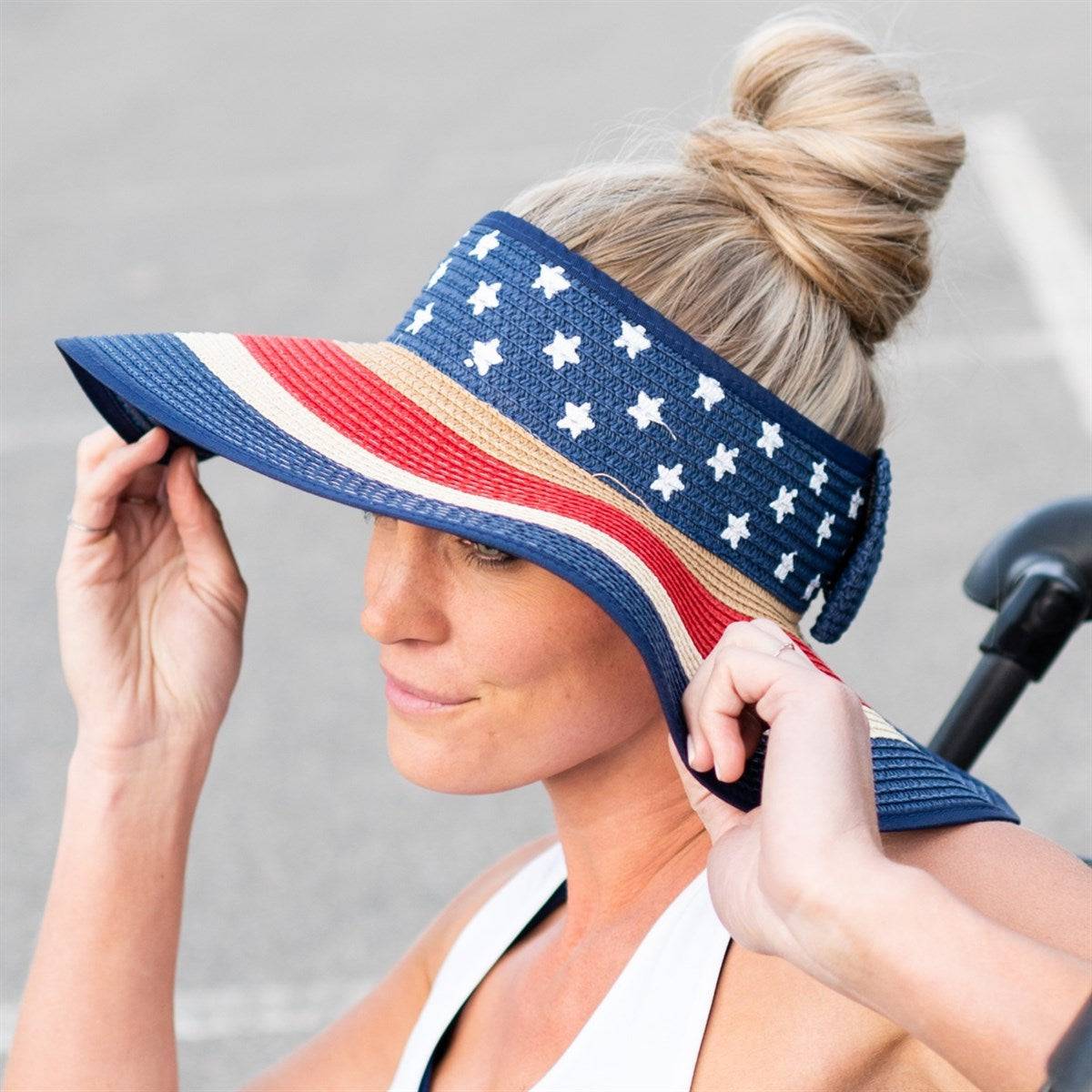 Americana Patriotic Rollable Visor featuring a decorative bow and adjustable strap, perfect for outdoor activities and 4th of July celebrations.