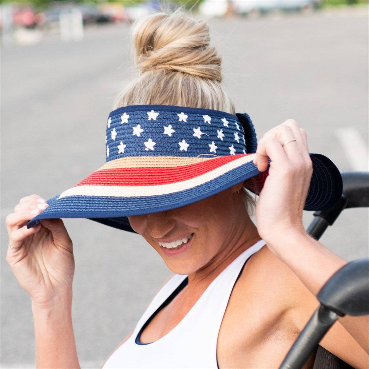 Americana Patriotic Rollable Visor featuring a decorative bow and adjustable strap, perfect for outdoor activities and 4th of July celebrations.