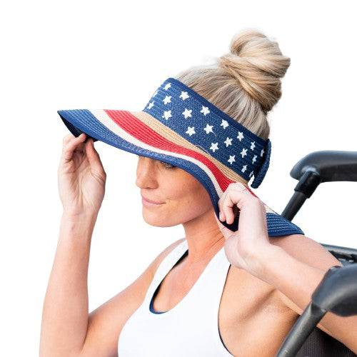 Americana Patriotic Rollable Visor featuring a decorative bow and adjustable strap, perfect for outdoor activities and 4th of July celebrations.