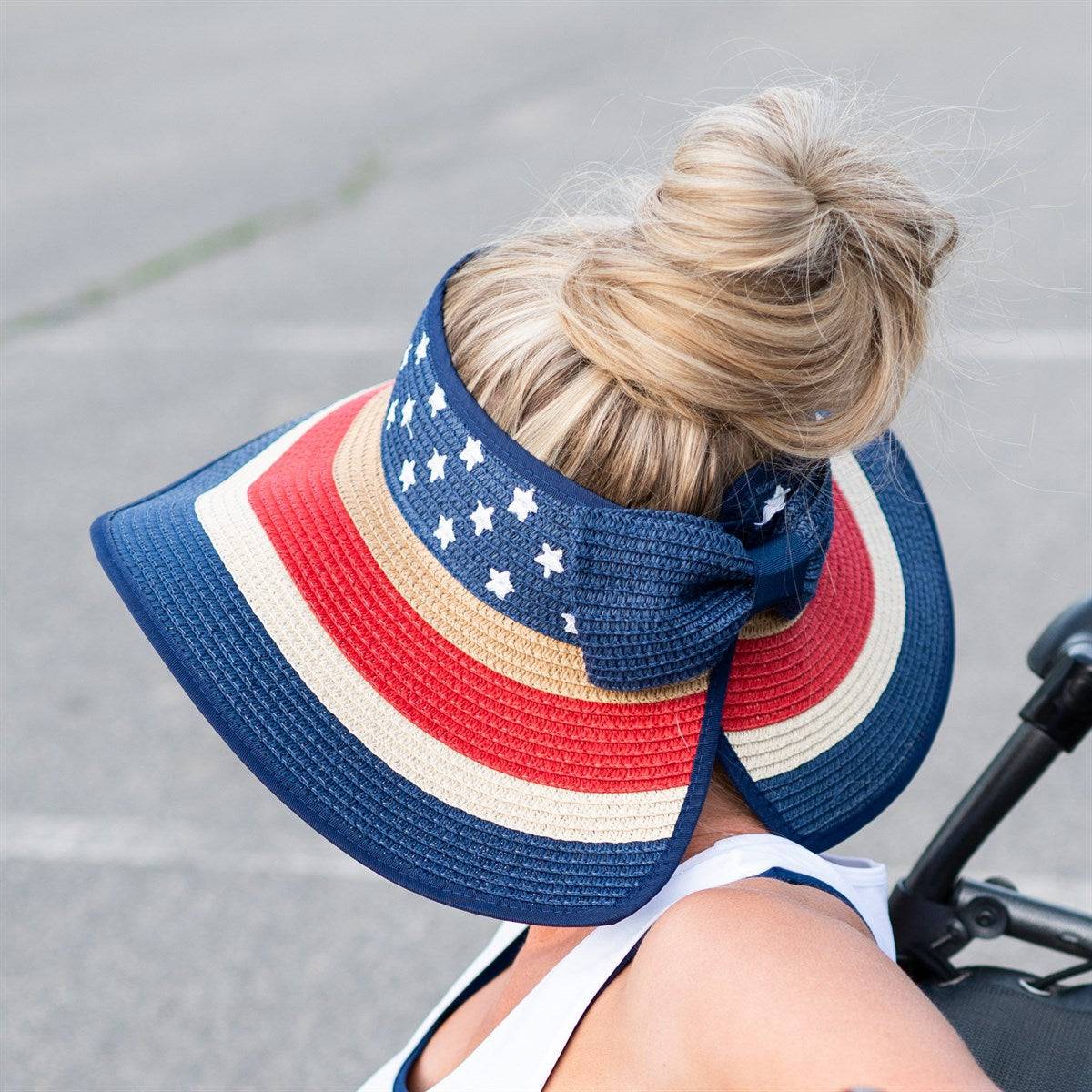 Americana Patriotic Rollable Visor featuring a decorative bow and adjustable strap, perfect for outdoor activities and 4th of July celebrations.