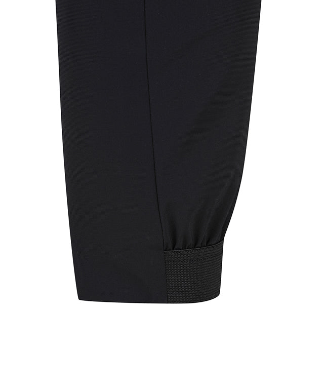 ANEW Golf Men Tricot Ventilation Long Pants in black, showcasing a modern jogger design with mesh ventilation and multiple pockets.