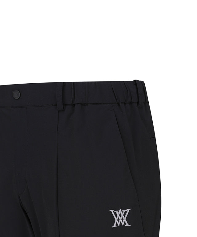 ANEW Golf Men Tricot Ventilation Long Pants in black, showcasing a modern jogger design with mesh ventilation and multiple pockets.