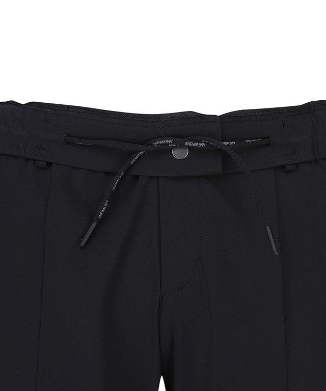 ANEW Golf Men Tricot Ventilation Long Pants in black, showcasing a modern jogger design with mesh ventilation and multiple pockets.