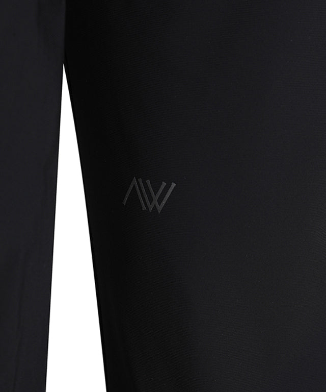 ANEW Golf Men Tricot Ventilation Long Pants in black, showcasing a modern jogger design with mesh ventilation and multiple pockets.