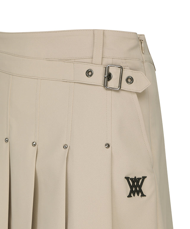 ANEW Golf Women's Buckle Decoration Pleats Skirt in Beige, showcasing pleats and buckle details.