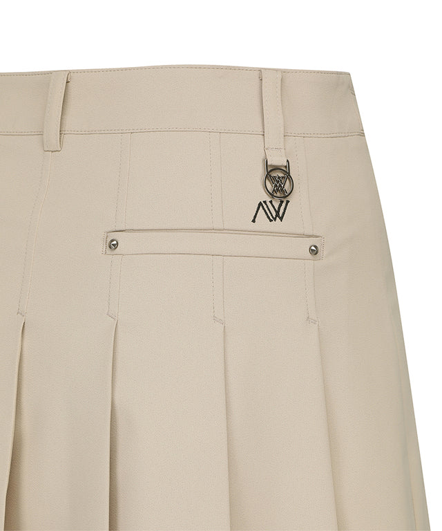 ANEW Golf Women's Buckle Decoration Pleats Skirt in Beige, showcasing pleats and buckle details.