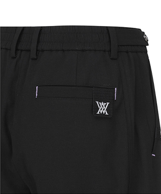 Women Incision Pocket Jogger Long Pants in black with unique incision pocket design and adjustable waistband.