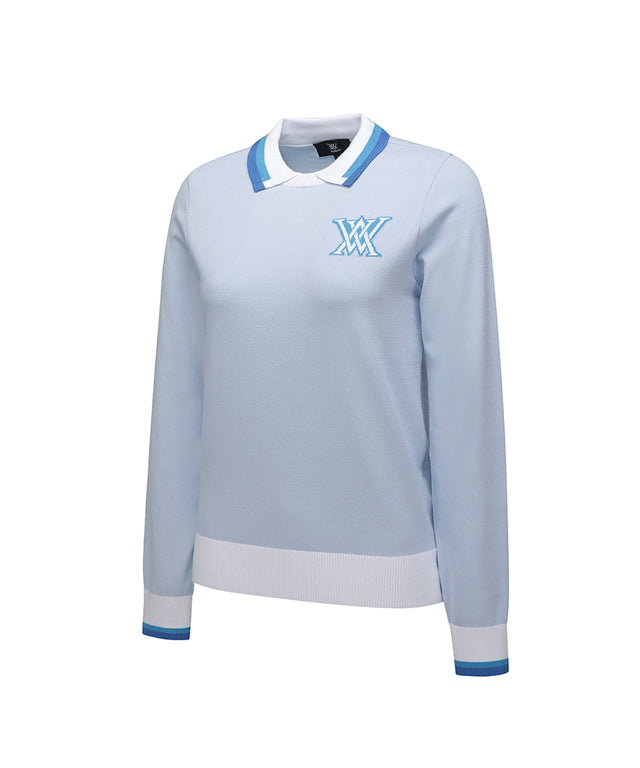 Sky blue knitted pullover sweater for women with logo and pastel color combination, featuring a round neck and button detail at the hem.