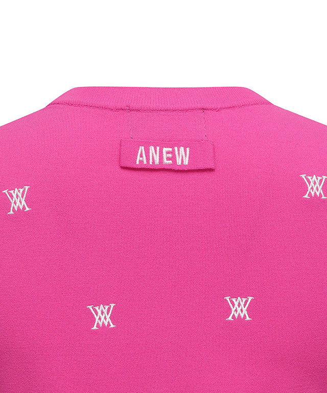 Pink pullover sweater for women featuring monogram logo and point color sleeves, perfect for golf or casual wear.