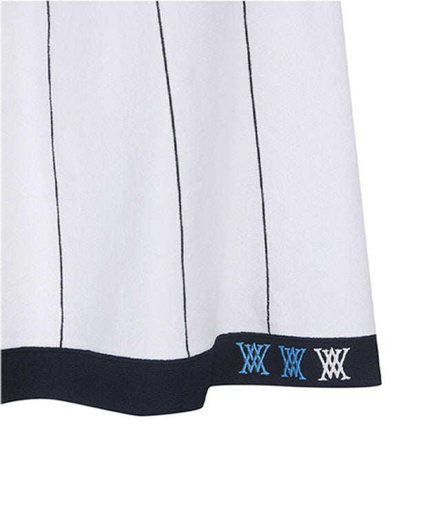 ANEW Golf Women Preppy Set-Up Skirt in White with blue stripes and multi-colored waistband, featuring logo embroidery on the hem.