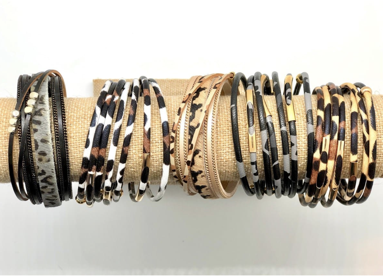 A stylish collection of animal print wrap bracelets featuring various patterns and colors, showcasing their unique design and magnetic closure.