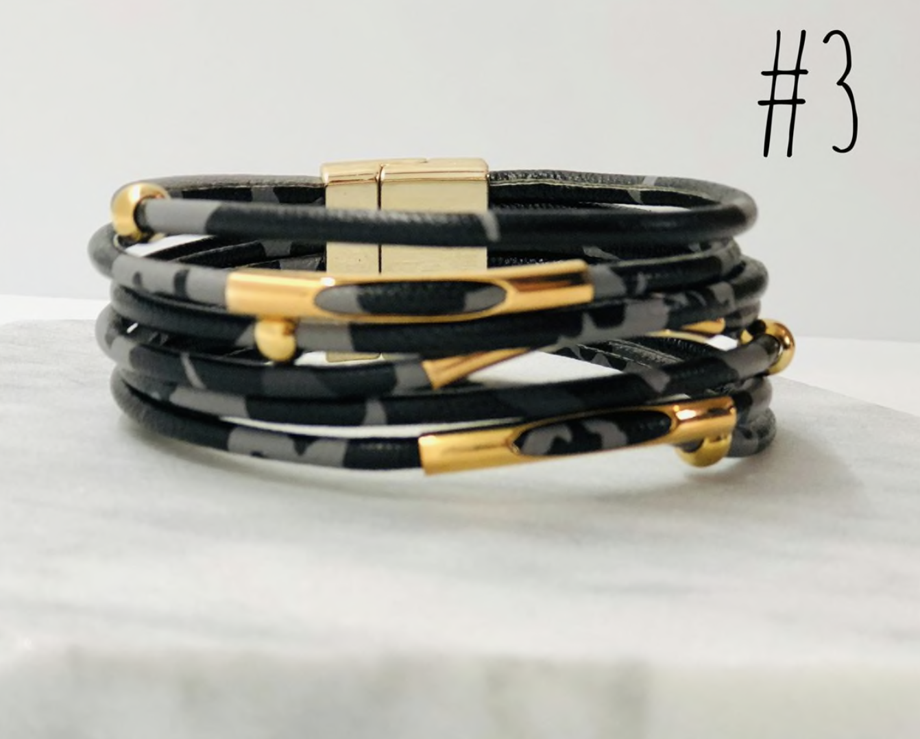 A stylish collection of animal print wrap bracelets featuring various patterns and colors, showcasing their unique design and magnetic closure.