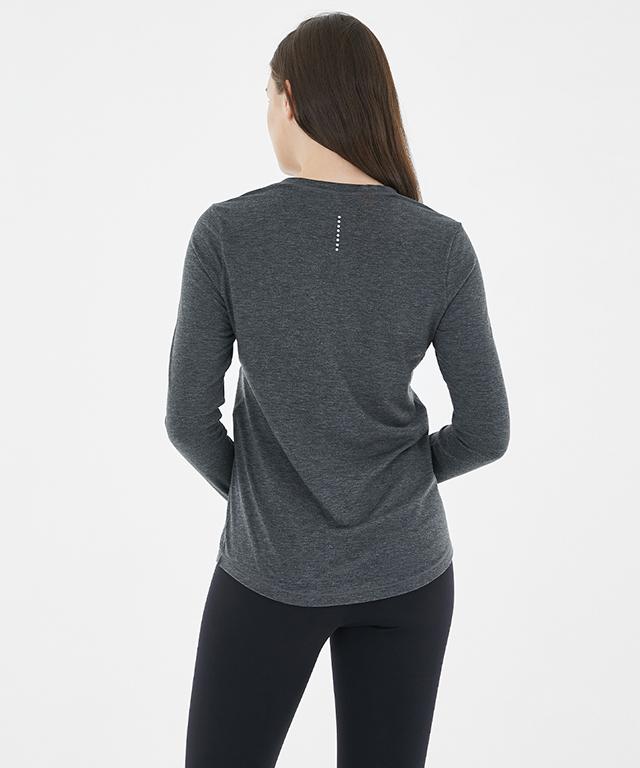 A stylish Anytime Long Sleeve shirt featuring a relaxed fit, diagonal waistline, and reflective tape details.