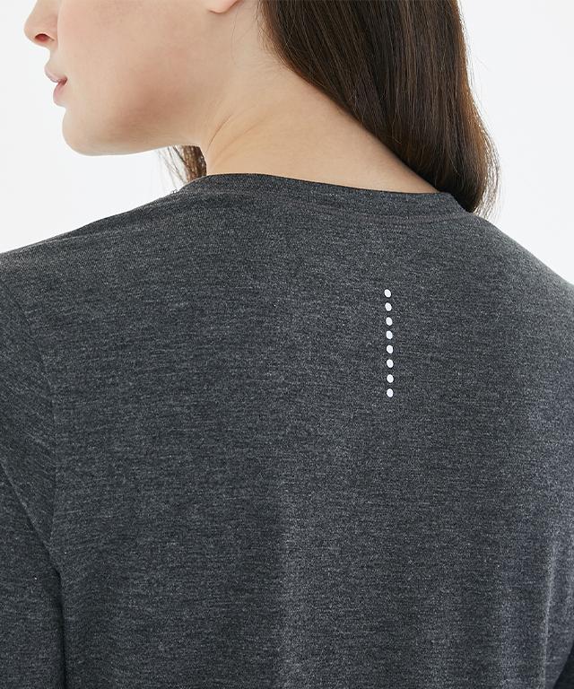 A stylish Anytime Long Sleeve shirt featuring a relaxed fit, diagonal waistline, and reflective tape details.