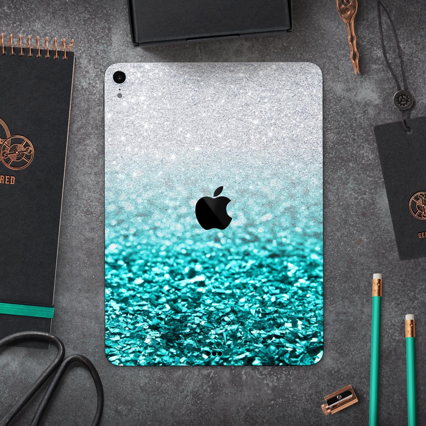 Aqua Blue and Silver Glimmer Fade full body skin decal for Apple devices, showcasing vibrant colors and a sleek design.