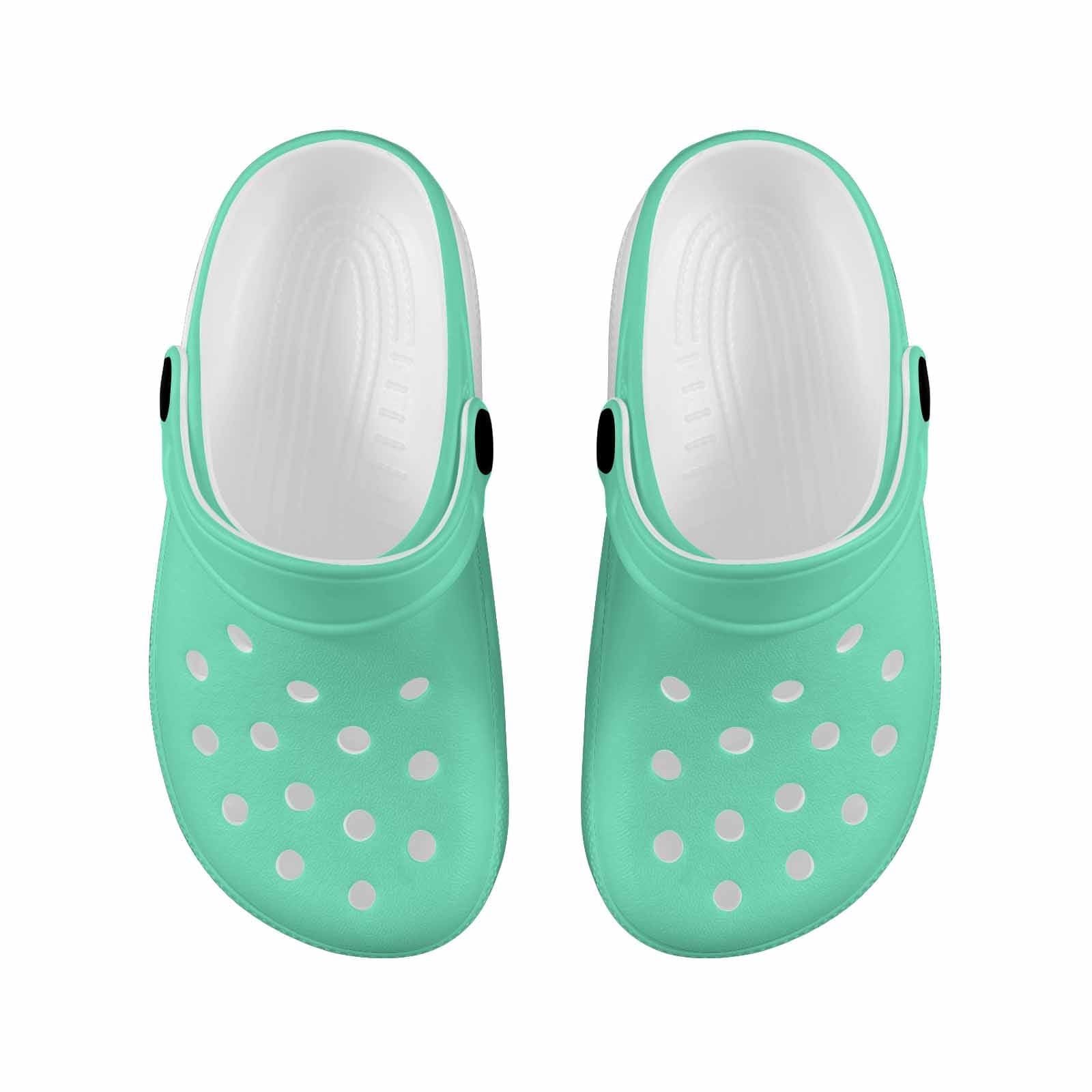 Aquamarine green clogs designed for youth, featuring a slip-on design, ventilation ports, and cushioned sole for comfort.