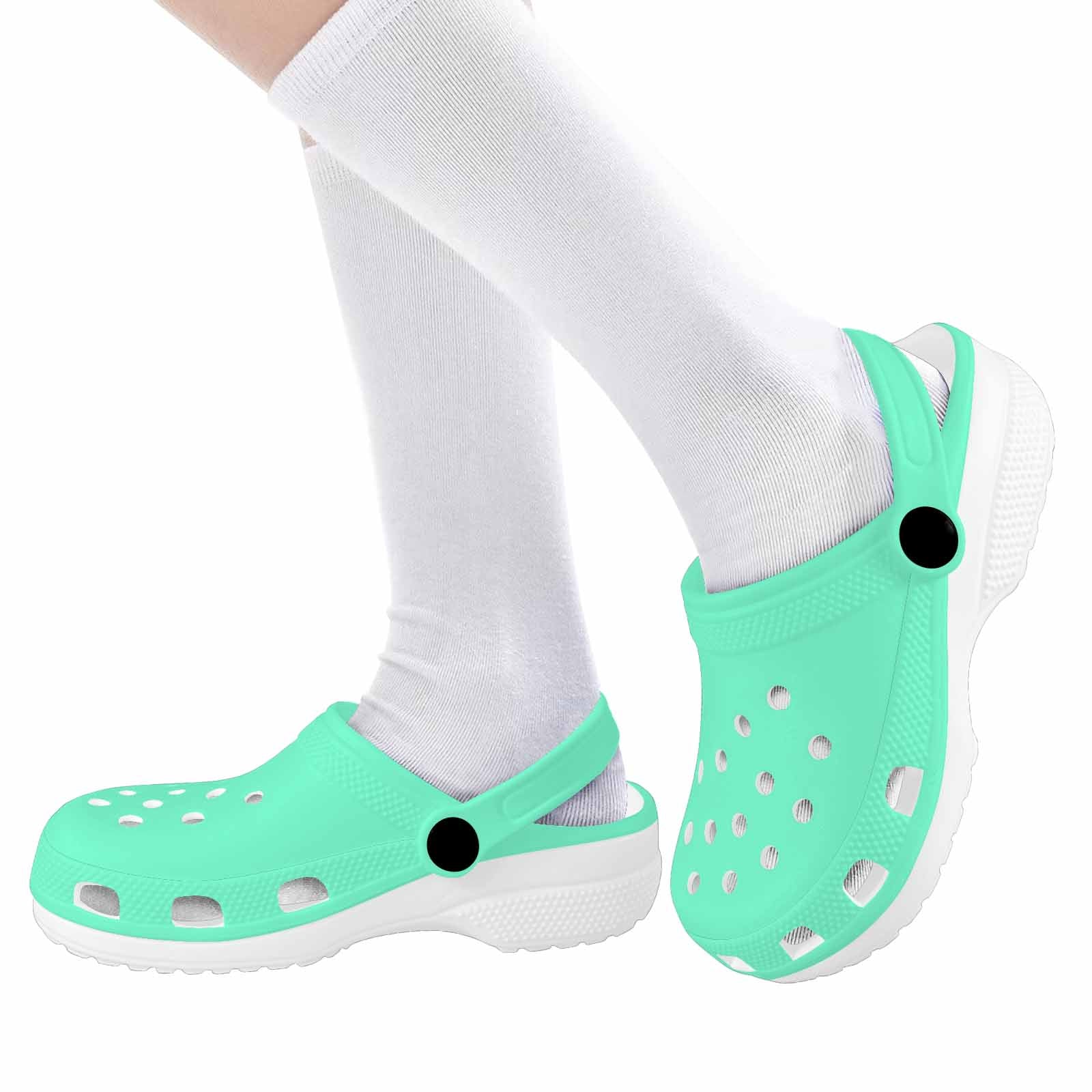 Aquamarine green clogs designed for youth, featuring a slip-on design, ventilation ports, and cushioned sole for comfort.