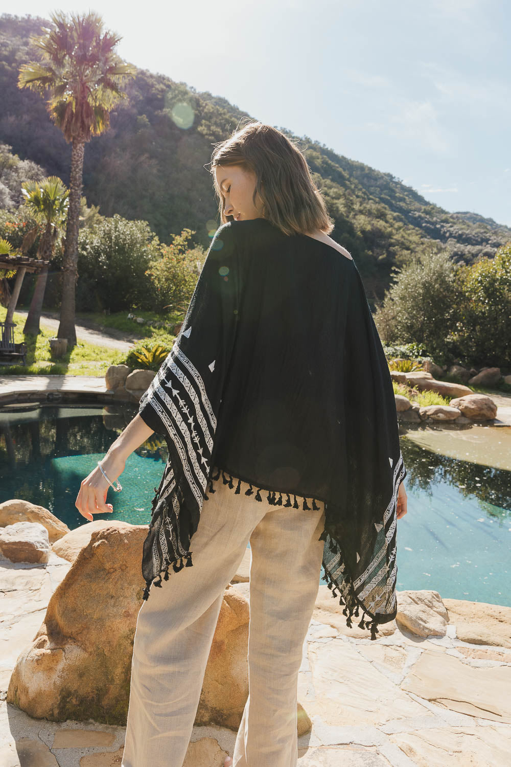 A stylish Aztec embroidered tunic featuring intricate patterns, lightweight fabric, and a comfortable fit, perfect for various outfits.