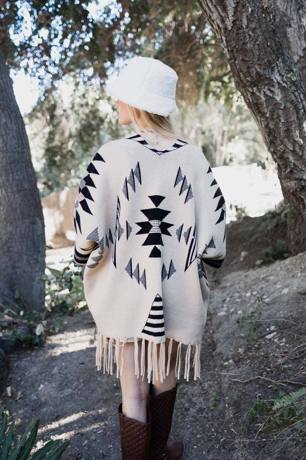 Aztec Luxe Fringed Ruana featuring stylish fringed trim and cozy fabric, perfect for fall and winter fashion.