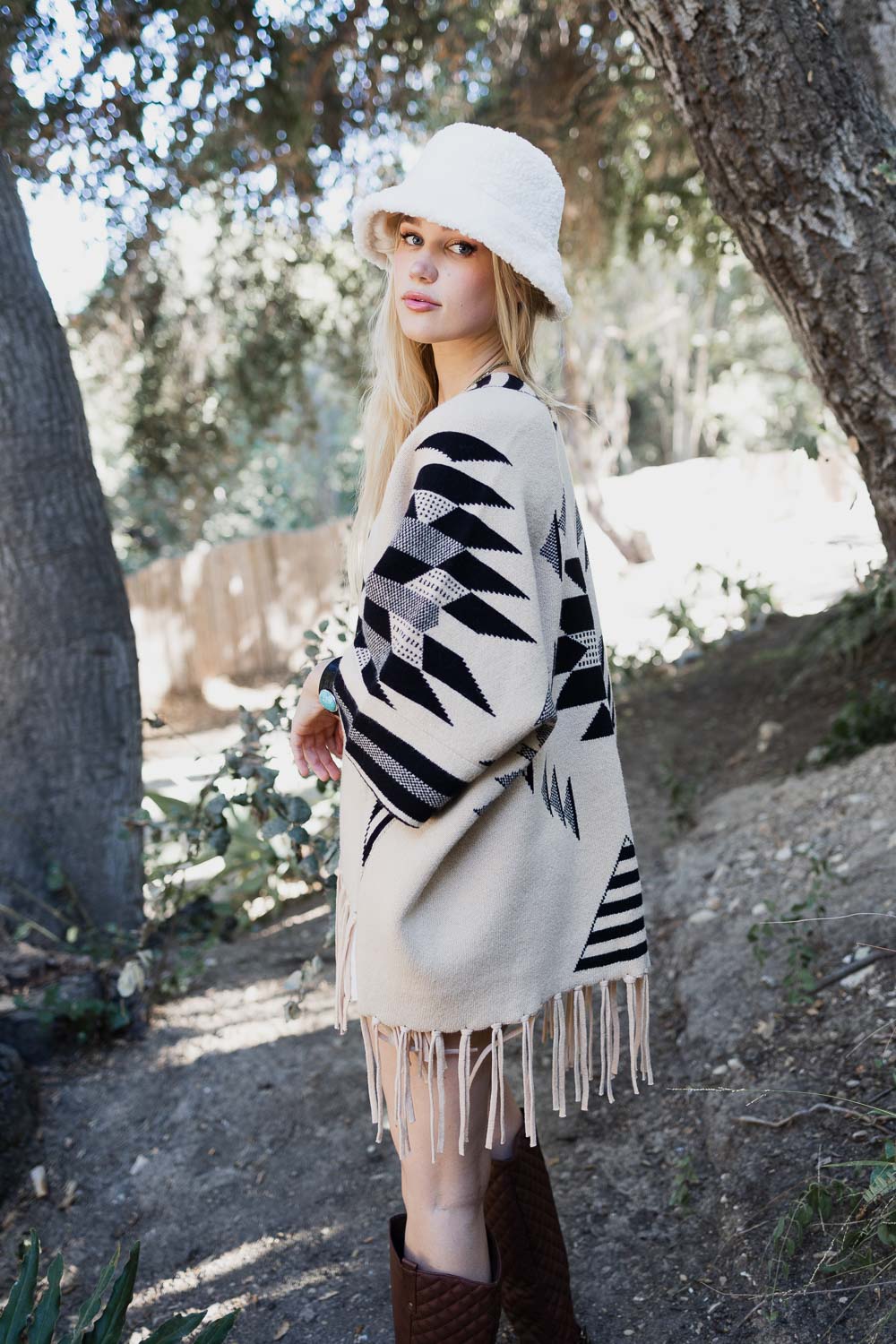 Aztec Luxe Fringed Ruana featuring stylish fringed trim and cozy fabric, perfect for fall and winter fashion.