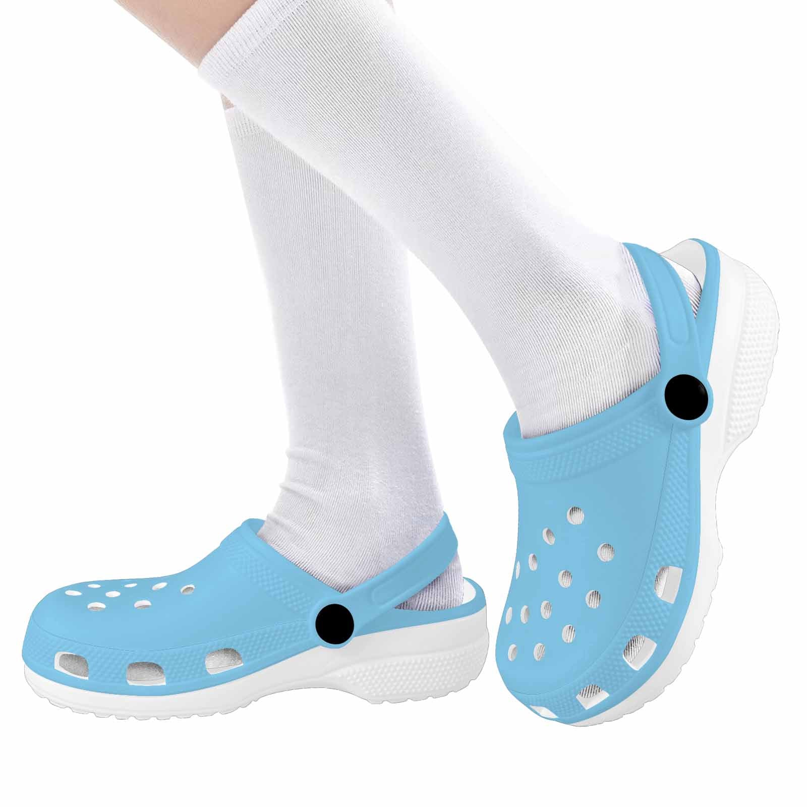 A pair of Baby Blue Clogs for Youth, featuring a lightweight design, breathable material, and cushioned sole, perfect for active kids.