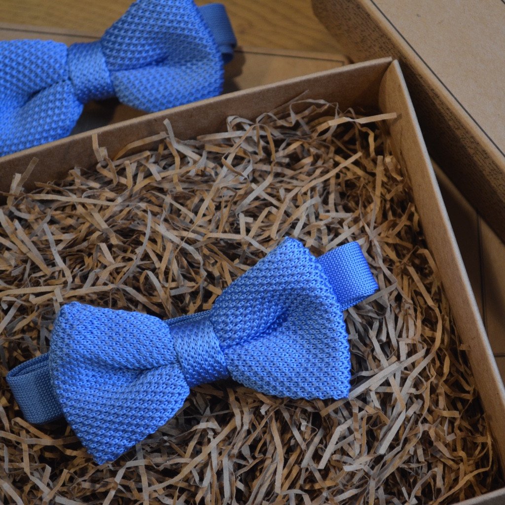 A stylish baby blue knitted wedding bow tie, handmade and pre-tied, perfect for formal occasions.