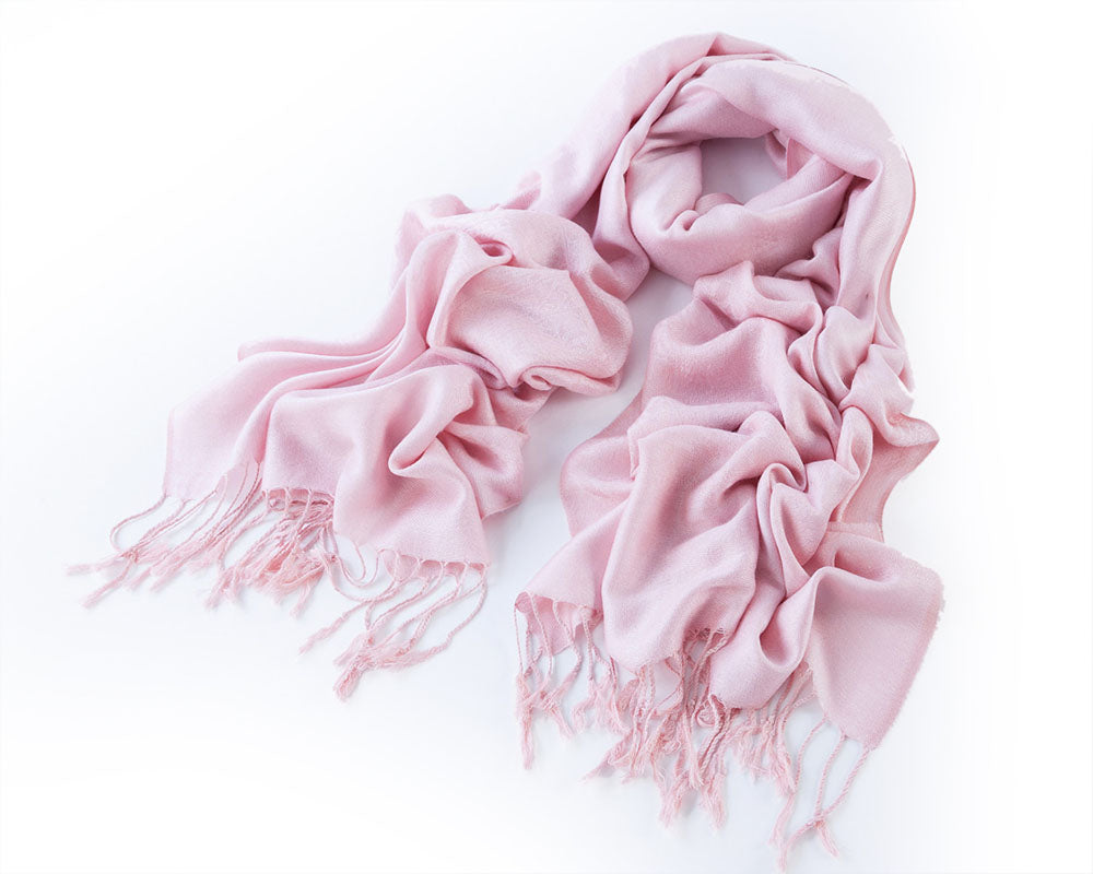 A soft and elegant Baby Pink Pashmina with fringe, perfect for wrapping or draping over dresses.